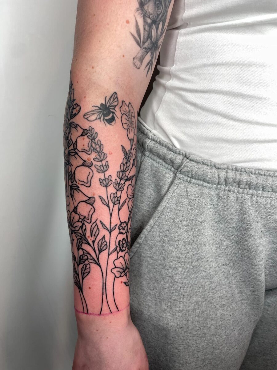 Elegant Floral Half Sleeve Tattoo Design