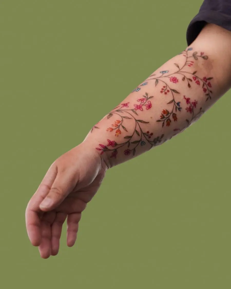 Vibrant floral half sleeve tattoo design