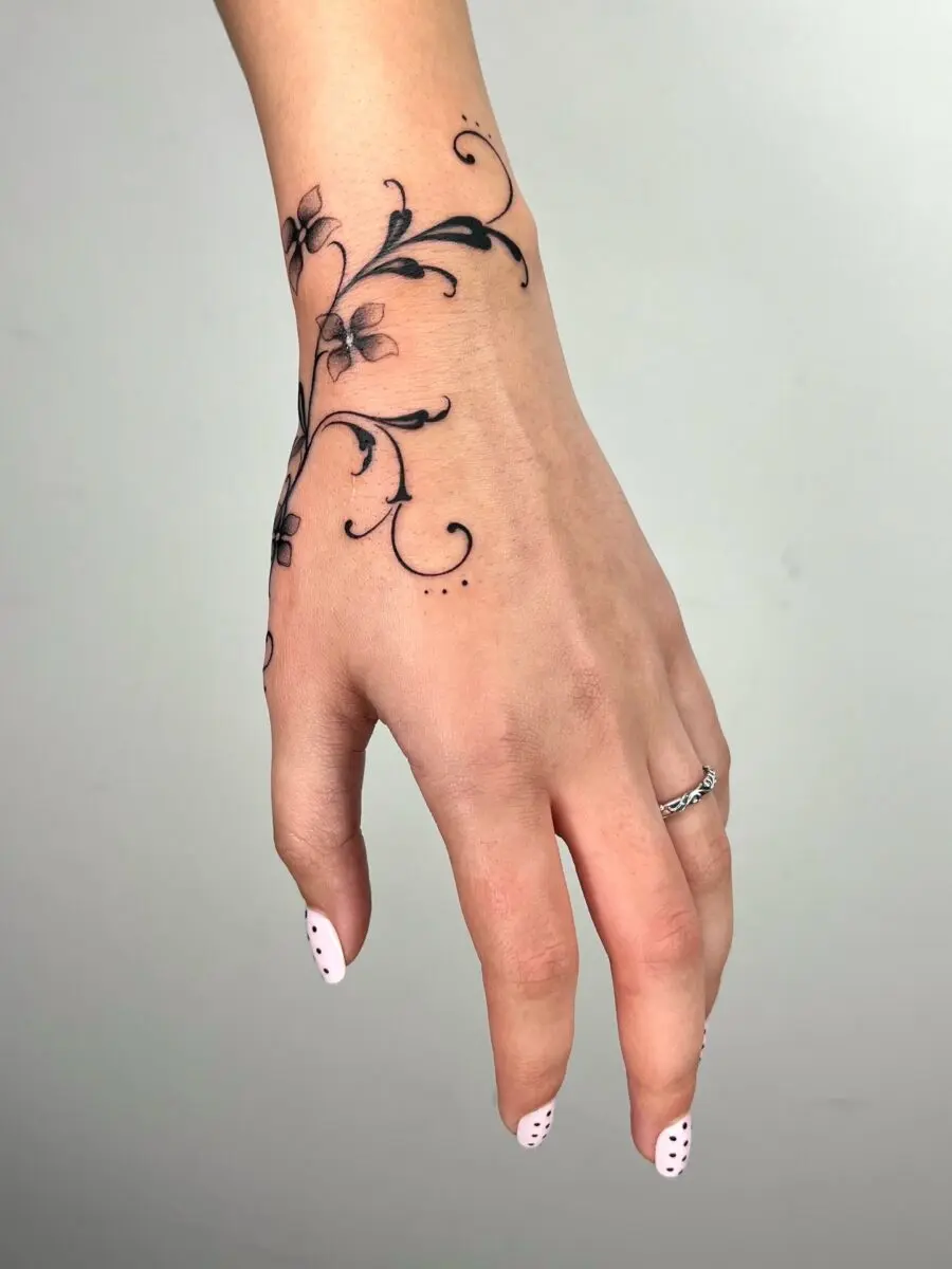Elegant floral tattoo design on the hand