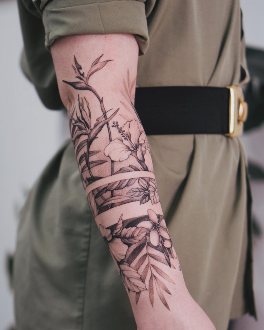 Elegant botanical half sleeve tattoo design