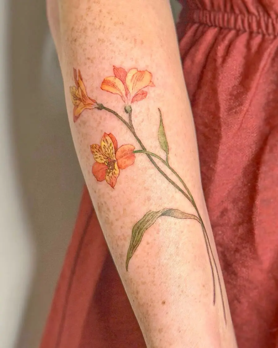 Vibrant floral tattoo on forearm