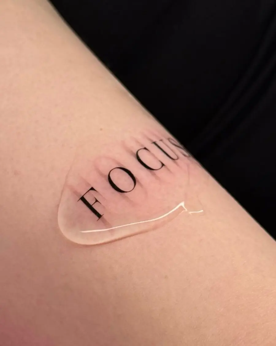 Minimalist 'Focus' Tattoo on Skin