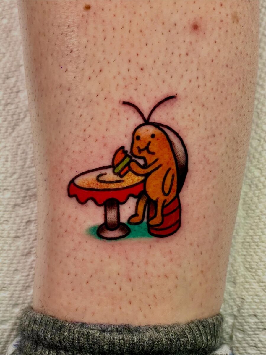 Whimsical bug enjoying a burger tattoo
