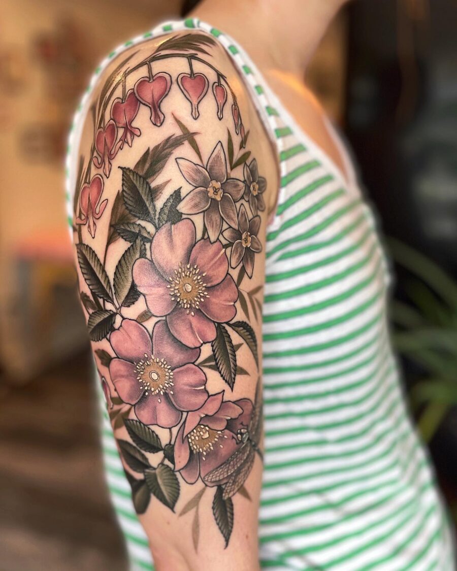 Vibrant floral half sleeve tattoo design
