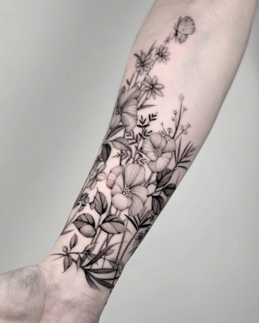 Elegant floral half sleeve tattoo design