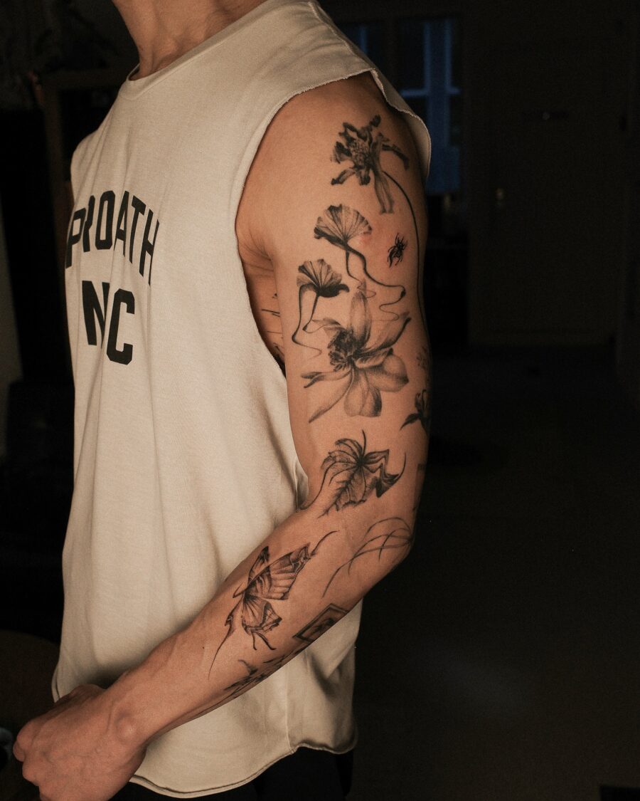 Elegant floral half sleeve tattoo design