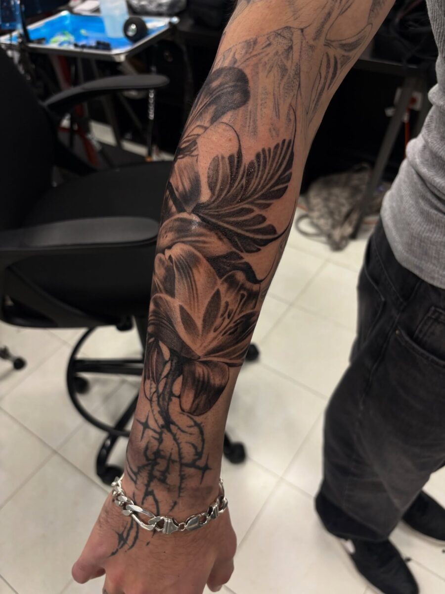 Elegant half sleeve floral tattoo design
