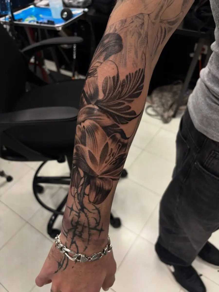 Elegant half sleeve floral tattoo design