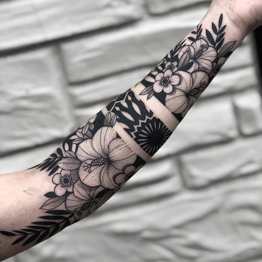 Elegant floral half sleeve tattoo design