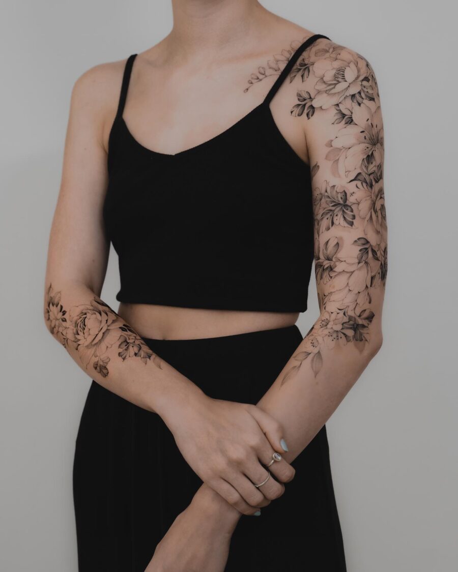 Elegant floral half sleeve tattoo design showcased
