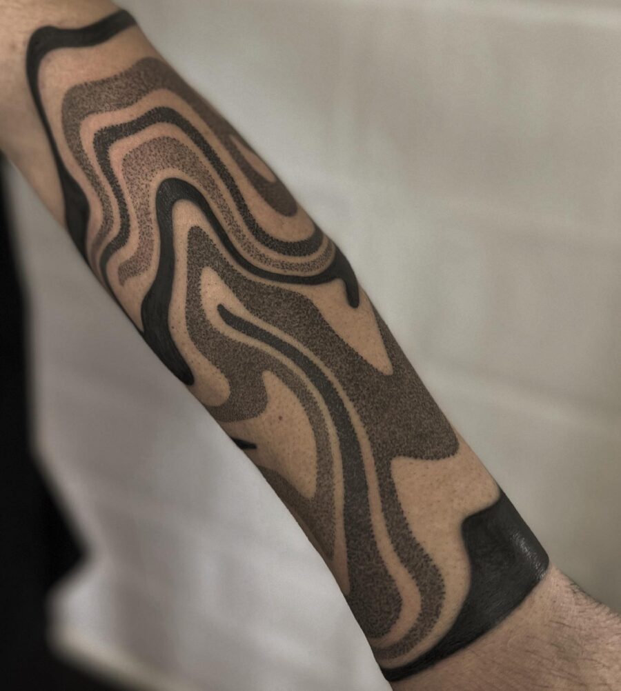 Abstract half sleeve tattoo with flowing patterns