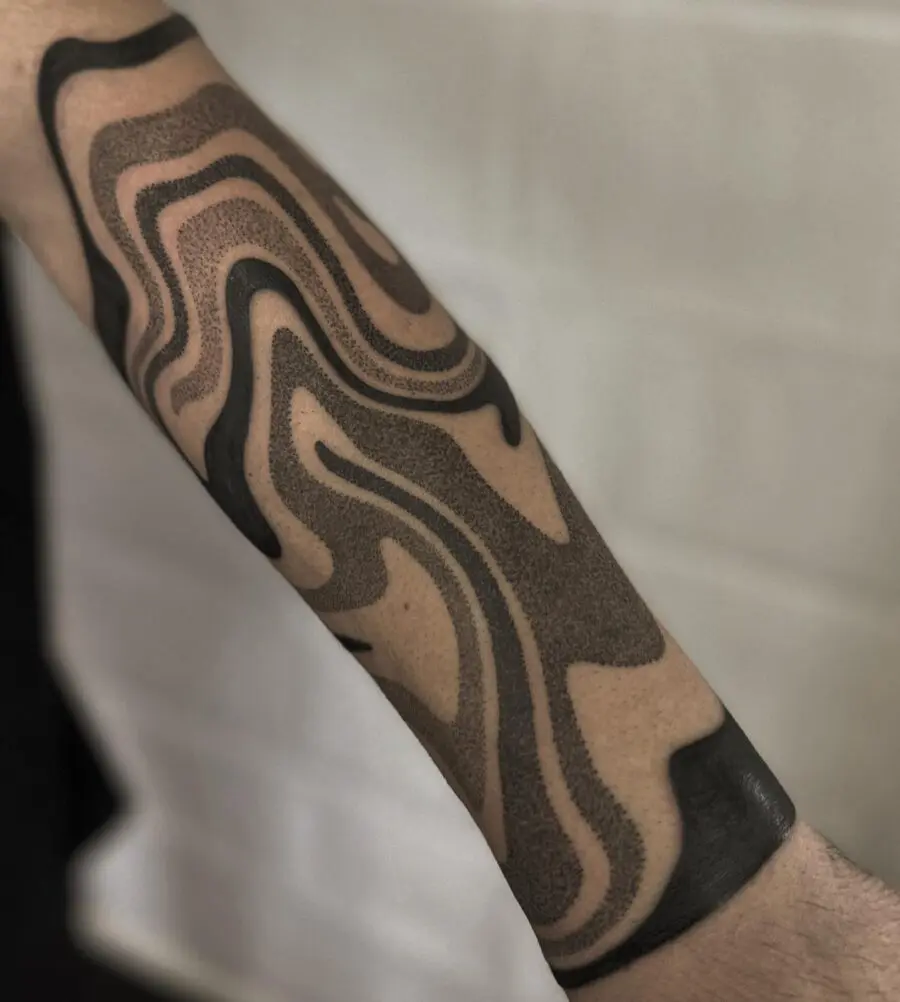Abstract half sleeve tattoo with flowing patterns