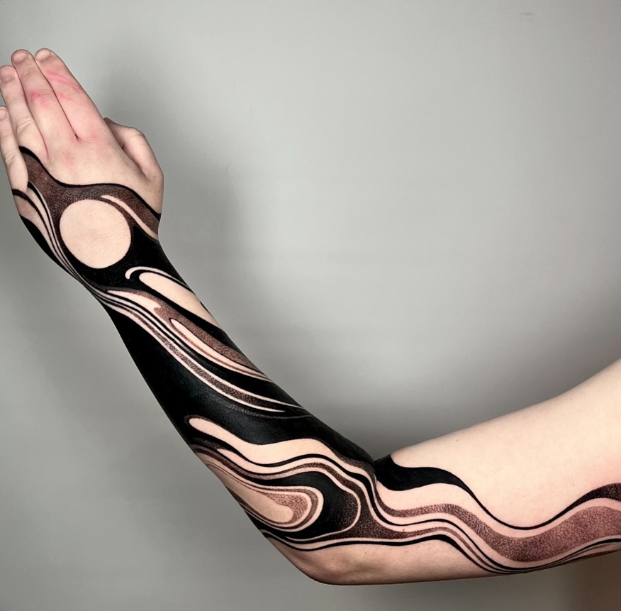Fluid black ink waves creating a striking design