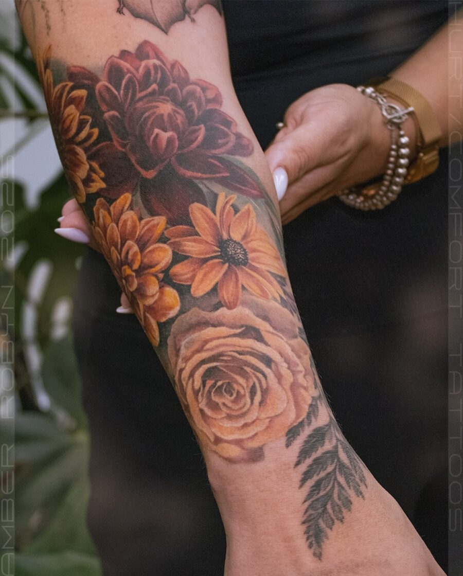 Vibrant floral half sleeve tattoo design