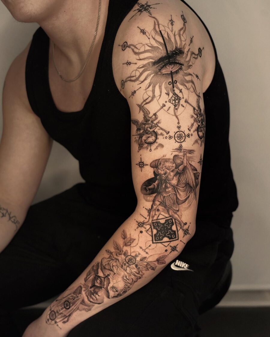 Stunning cosmic-inspired half sleeve tattoo design