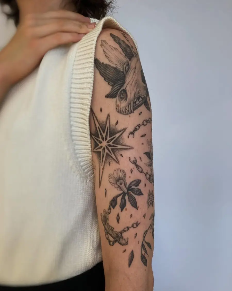 Intricate half sleeve tattoo blend of elements