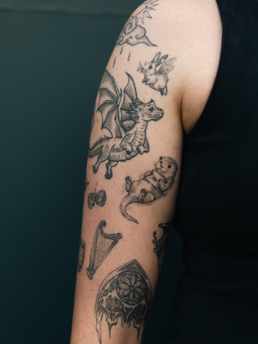 Unique tattoo designs with dragon and otter.