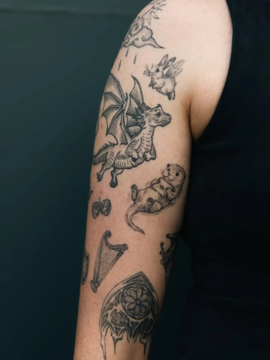 Unique tattoo designs with dragon and otter.