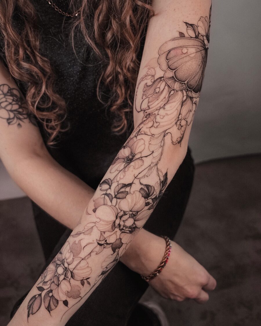 Elegant floral and butterfly half sleeve design
