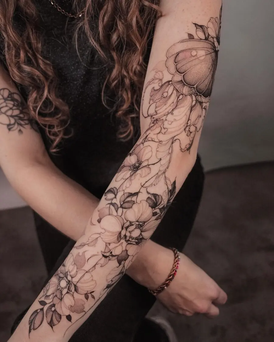 Elegant floral and butterfly half sleeve design