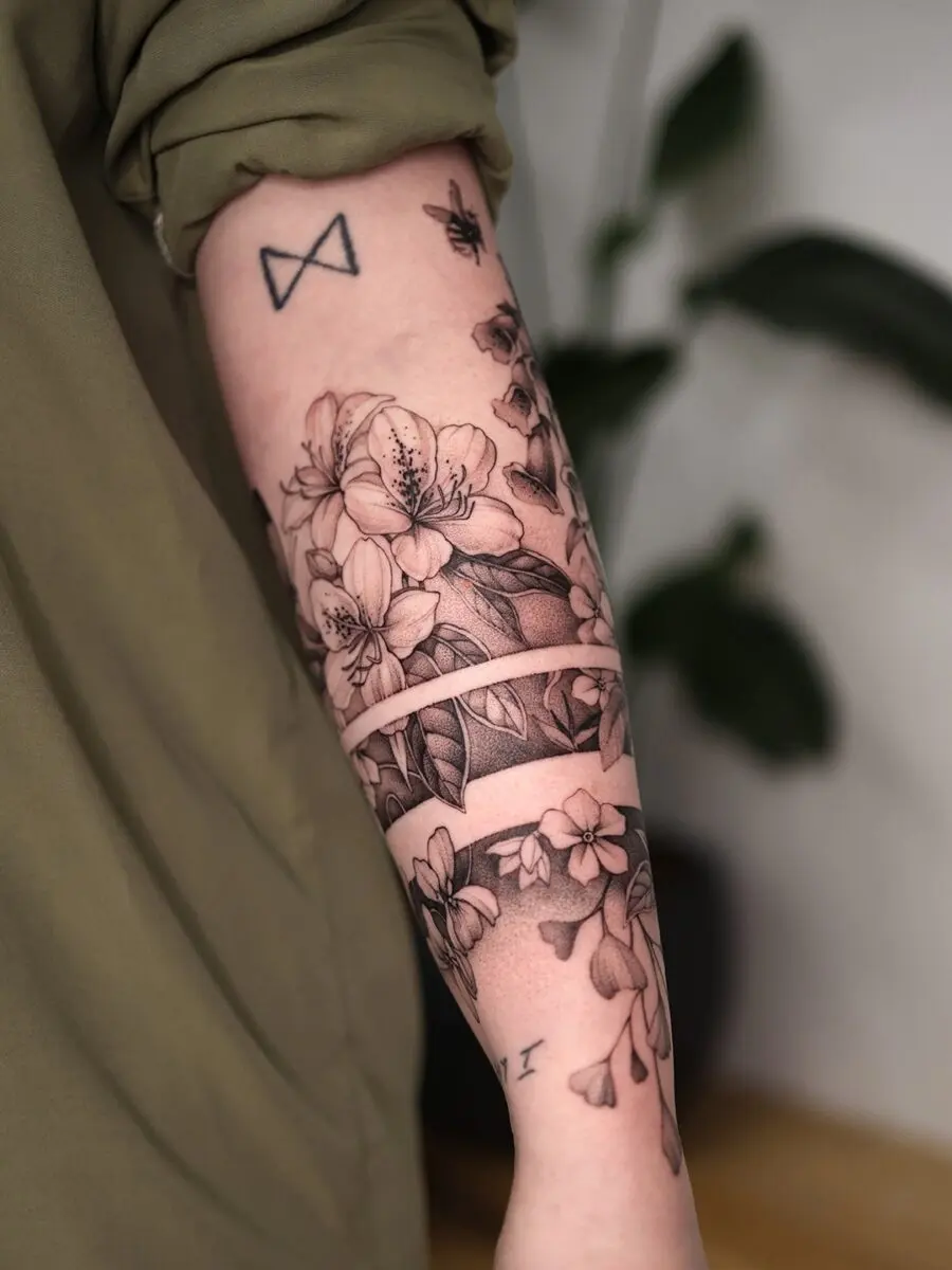 Elegant floral half sleeve tattoo design inspiration
