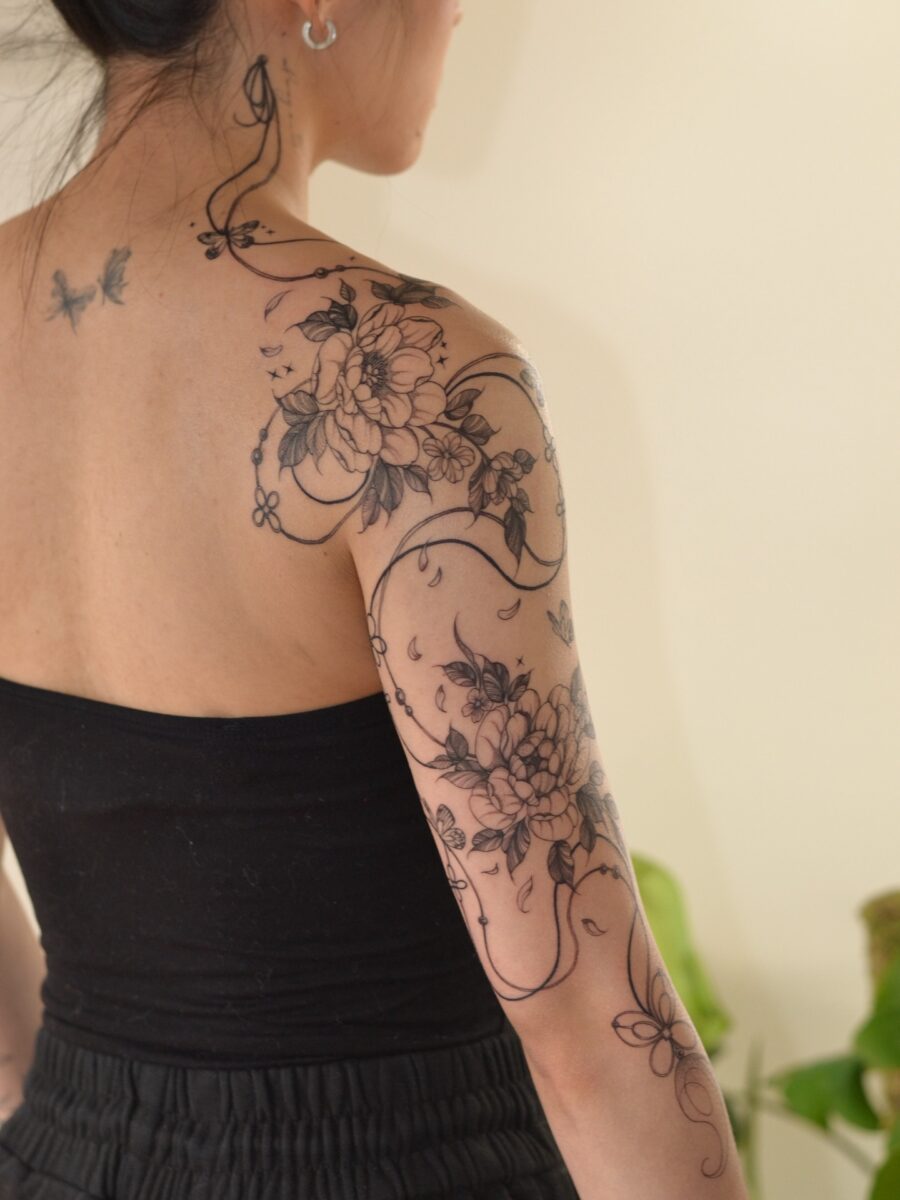 Elegant Floral Half Sleeve Tattoo Design
