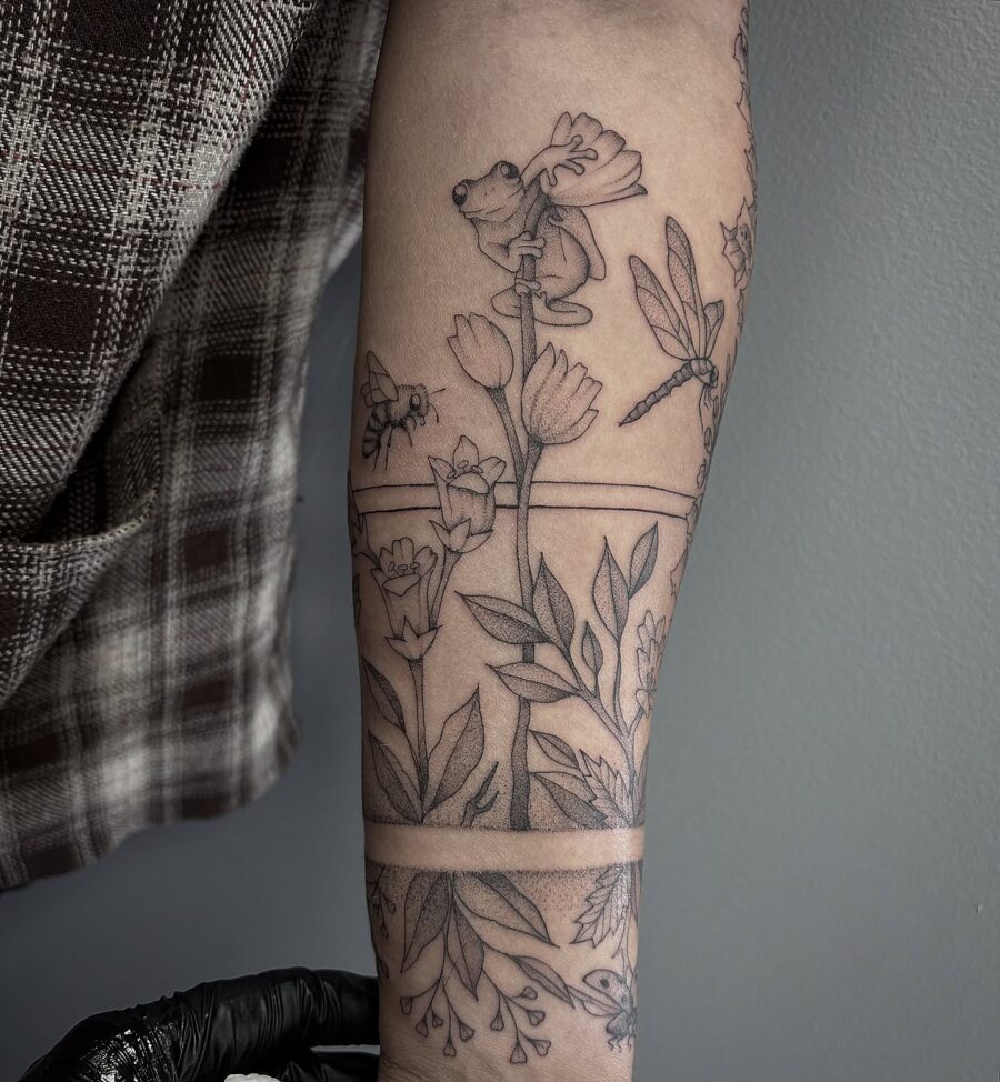Nature-inspired half sleeve tattoo with whimsical details