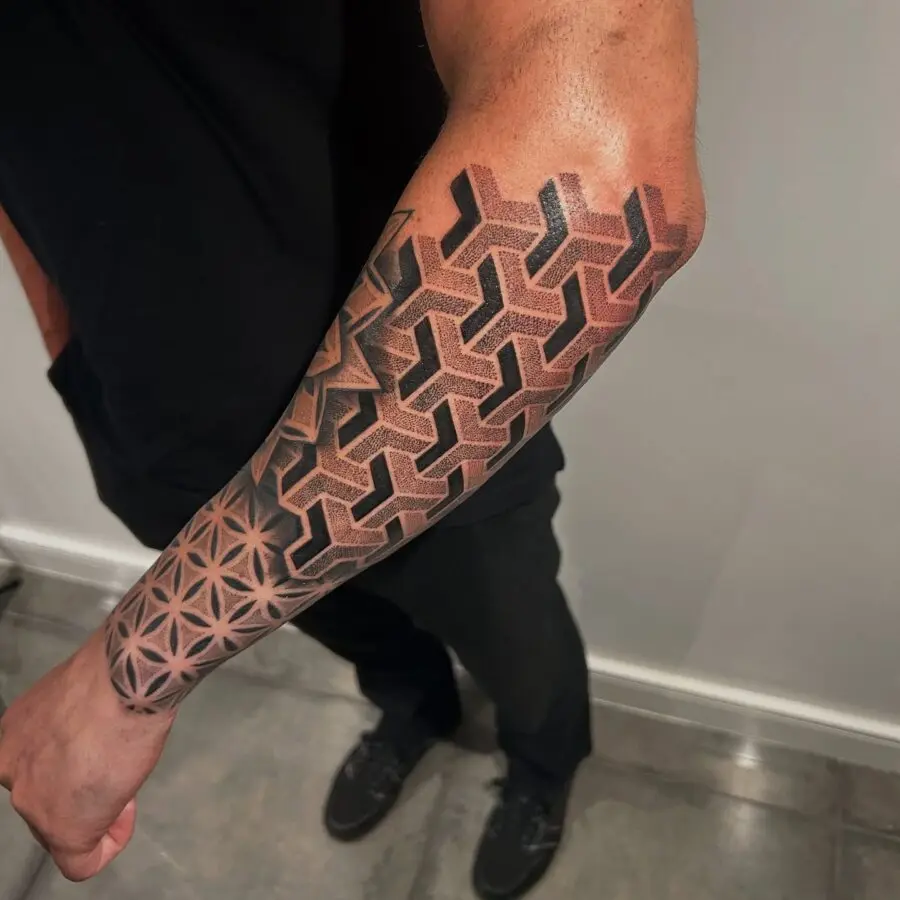 Intricate geometric half sleeve tattoo design