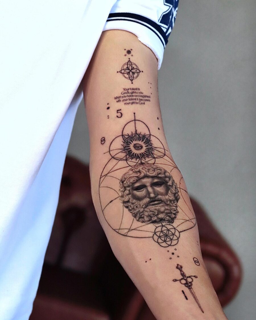 Intricate half sleeve tattoo featuring celestial designs