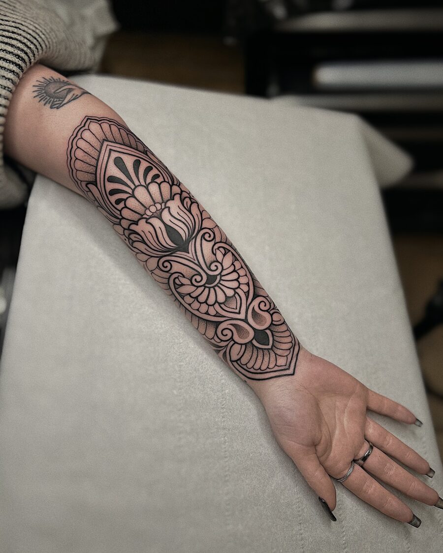 Intricate floral half sleeve tattoo design
