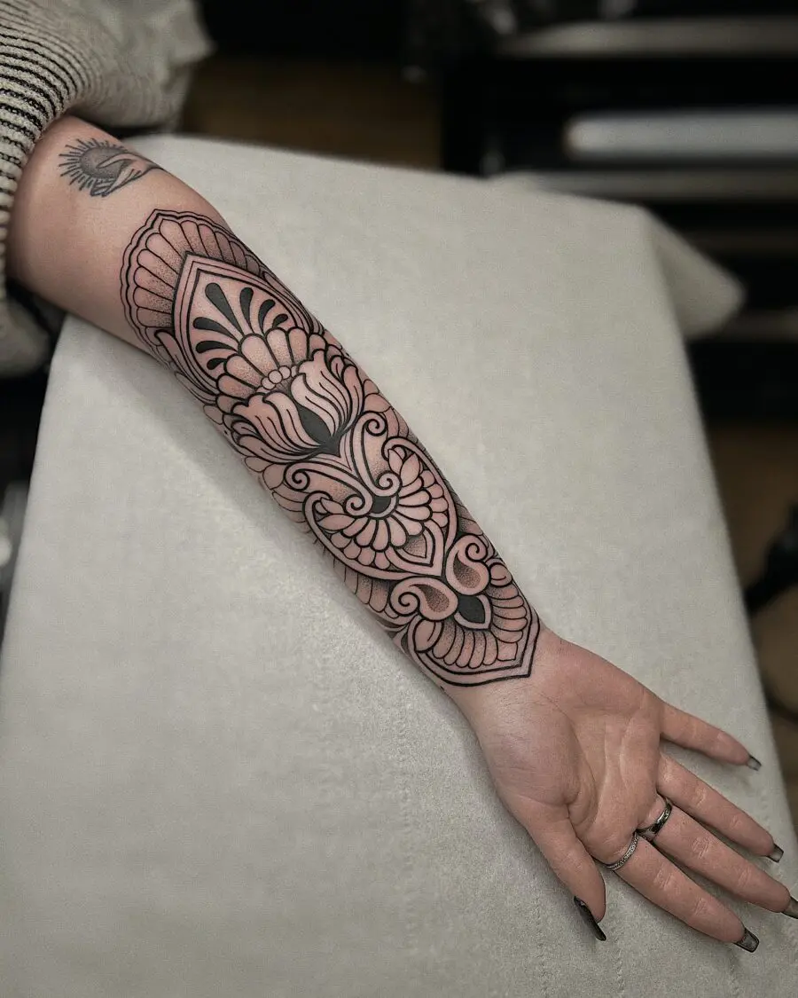Intricate floral half sleeve tattoo design
