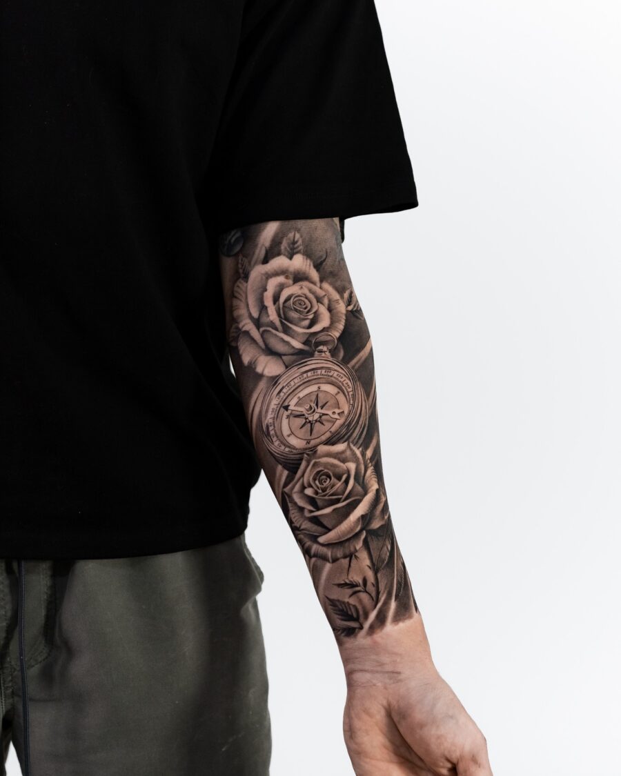 Elegant black and grey floral half sleeve tattoo
