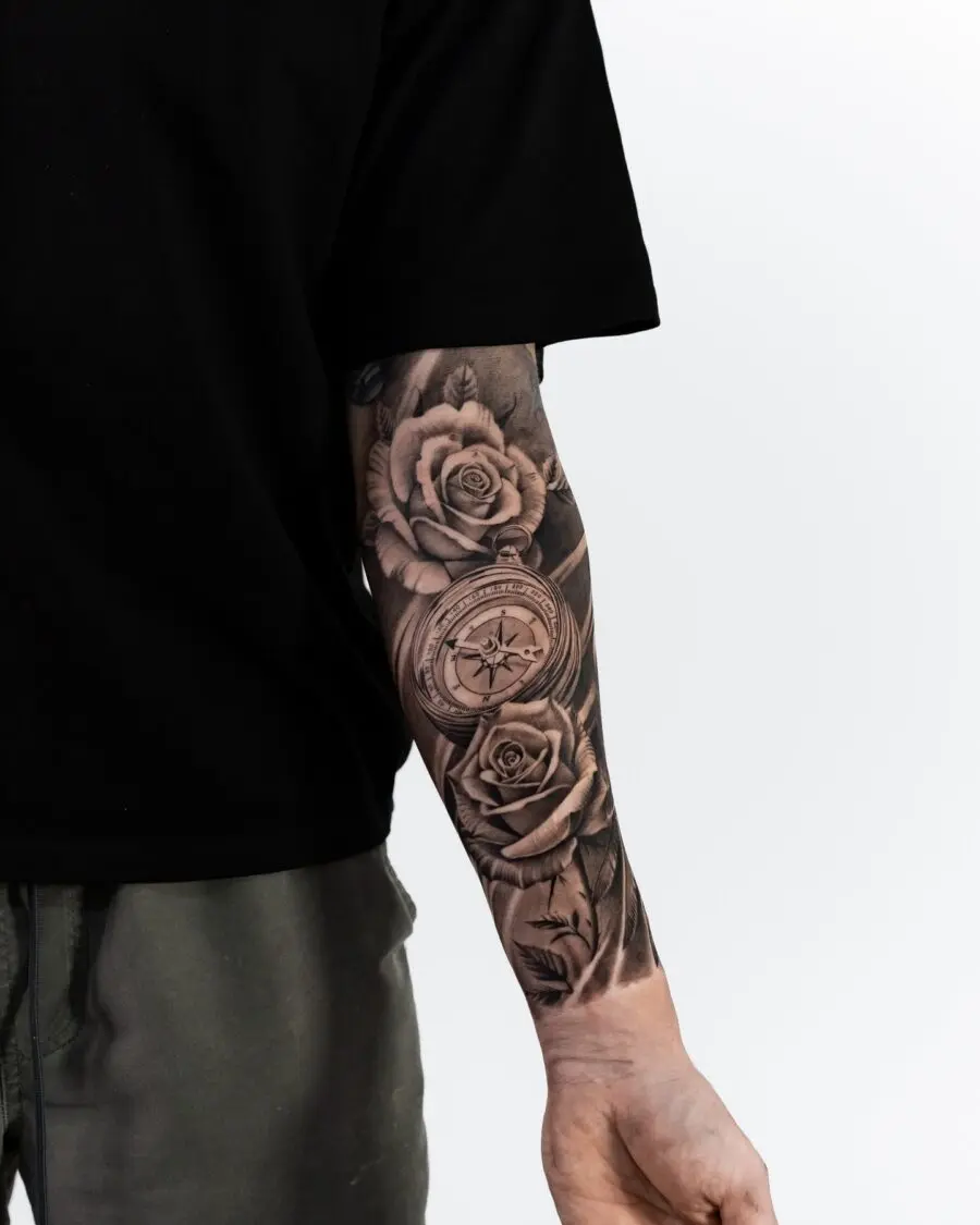Elegant black and grey floral half sleeve tattoo