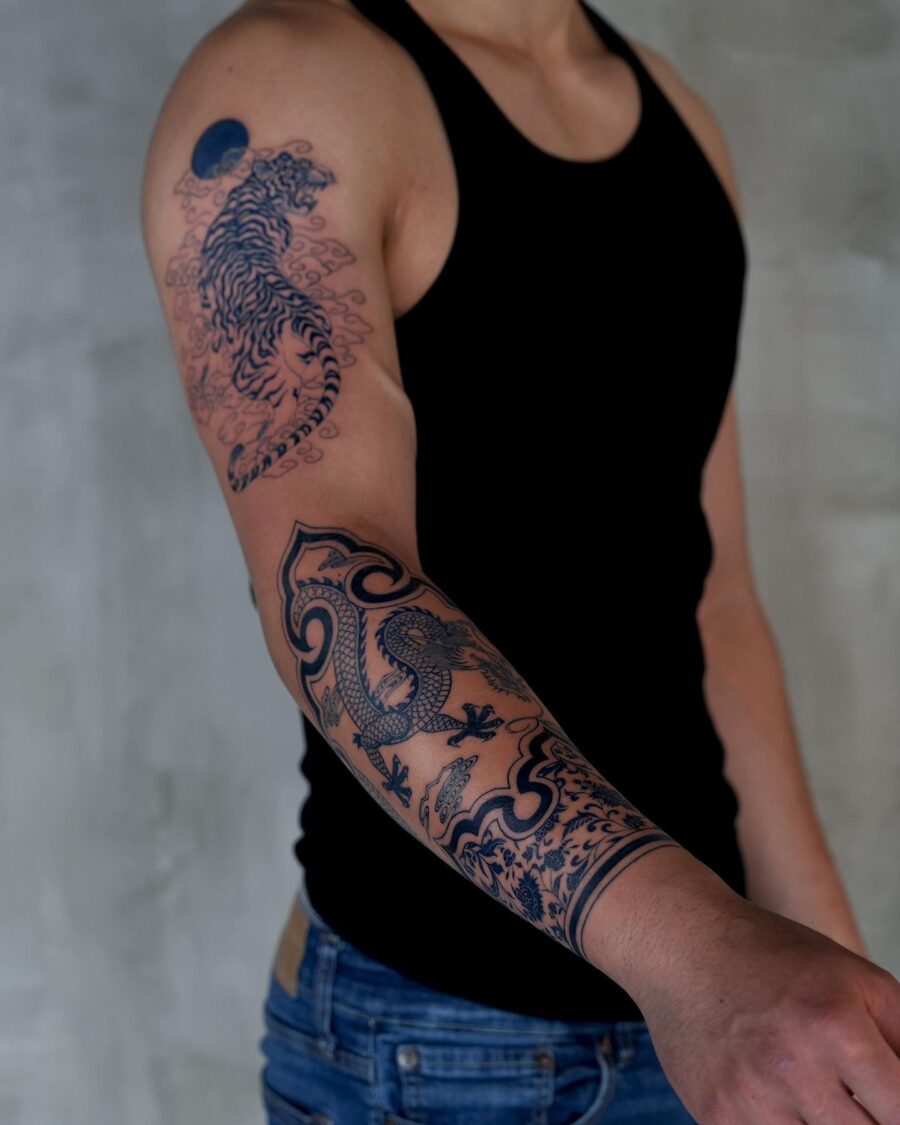 Stunning half sleeve tattoo with tiger design