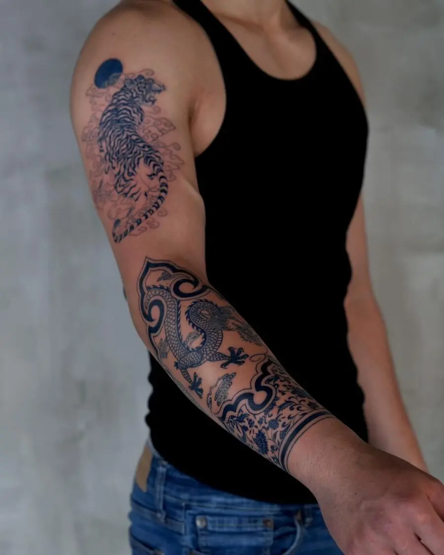 Stunning half sleeve tattoo with tiger design