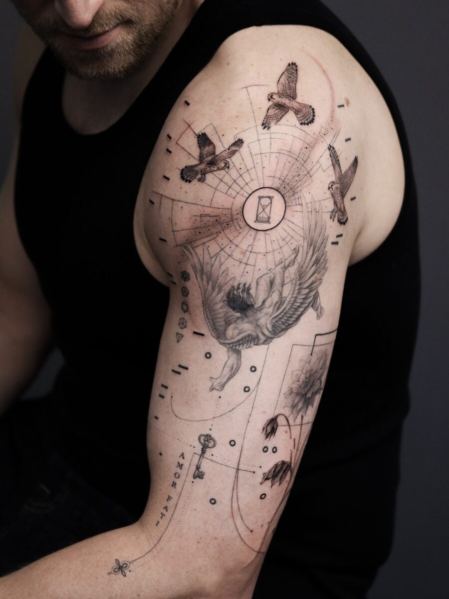 Elegant half sleeve tattoo with intricate designs