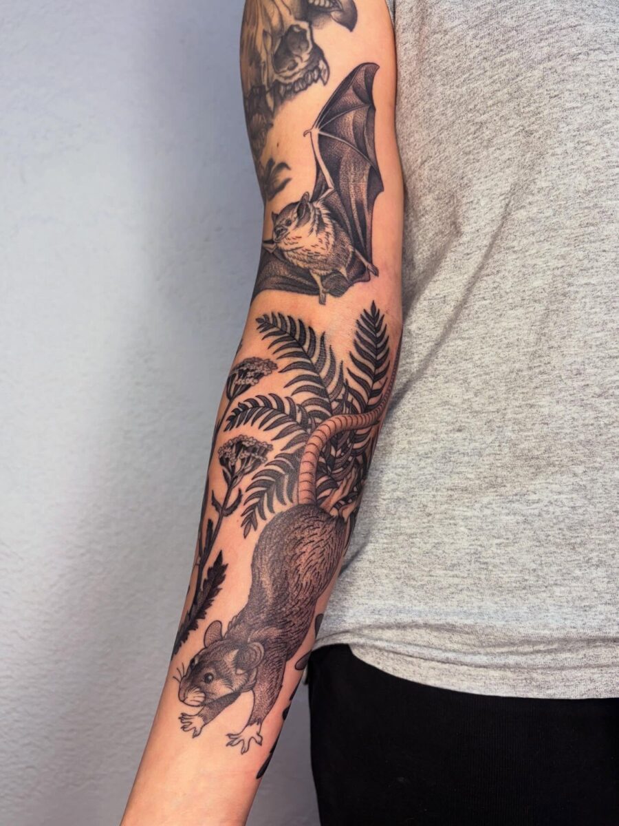 Nature-inspired half sleeve tattoo with animals