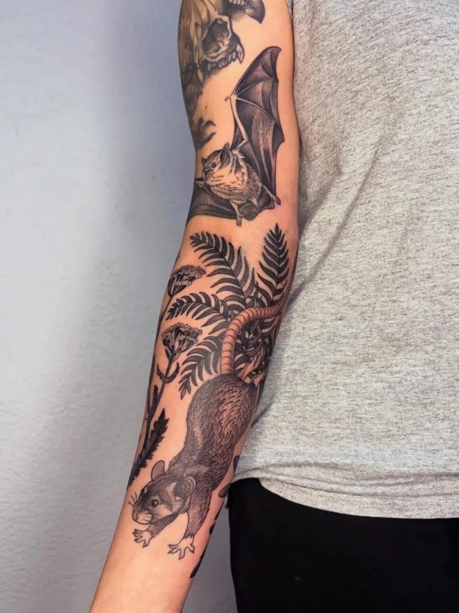 Nature-inspired half sleeve tattoo with animals