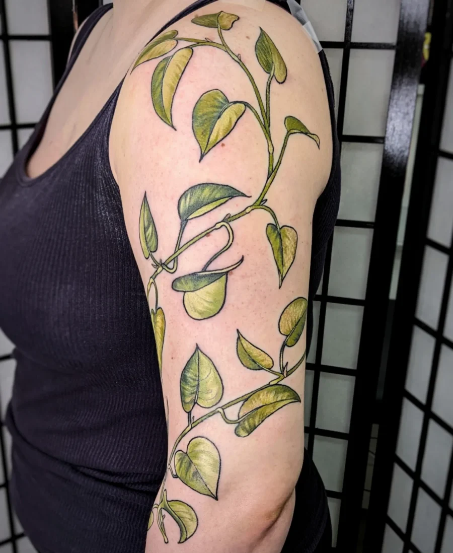 Elegant green leaf vine half sleeve tattoo
