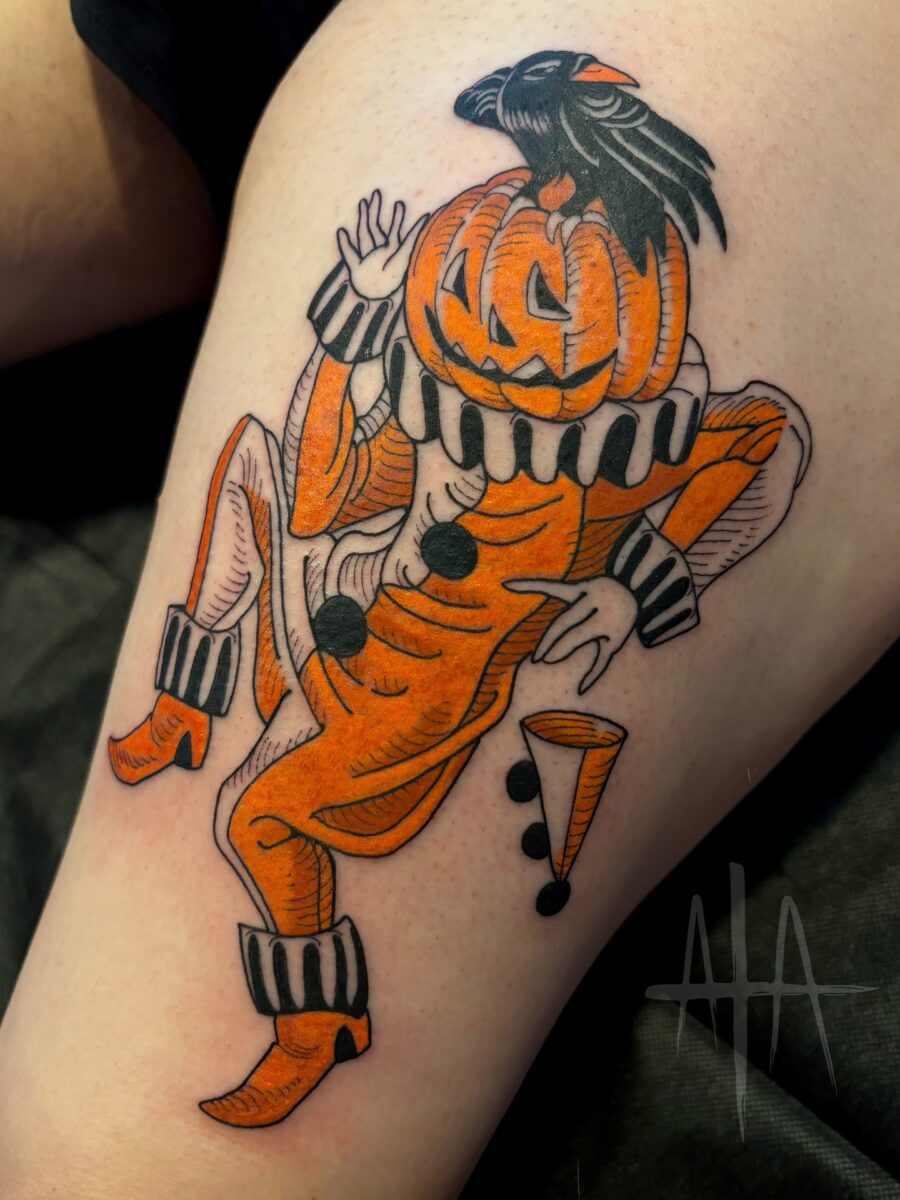 Charming pumpkin-clown tattoo for Halloween vibes