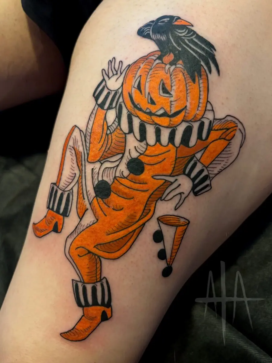 Charming pumpkin-clown tattoo for Halloween vibes