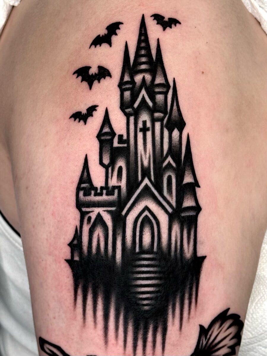 A hauntingly beautiful castle tattoo design