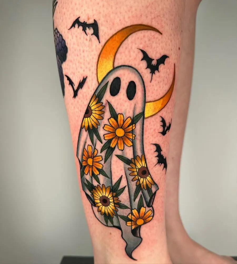Whimsical ghost tattoo with sunflowers and bats
