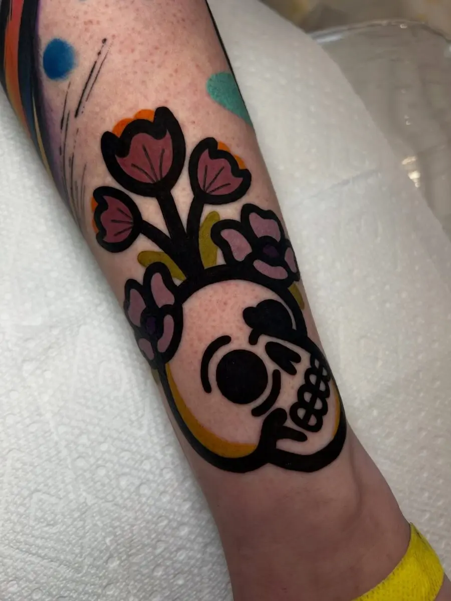 Whimsical skull with floral accents and colors