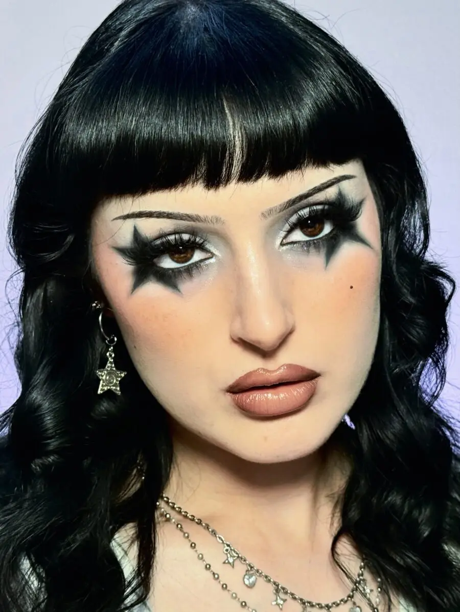 Dramatic halo eye makeup with bold tones