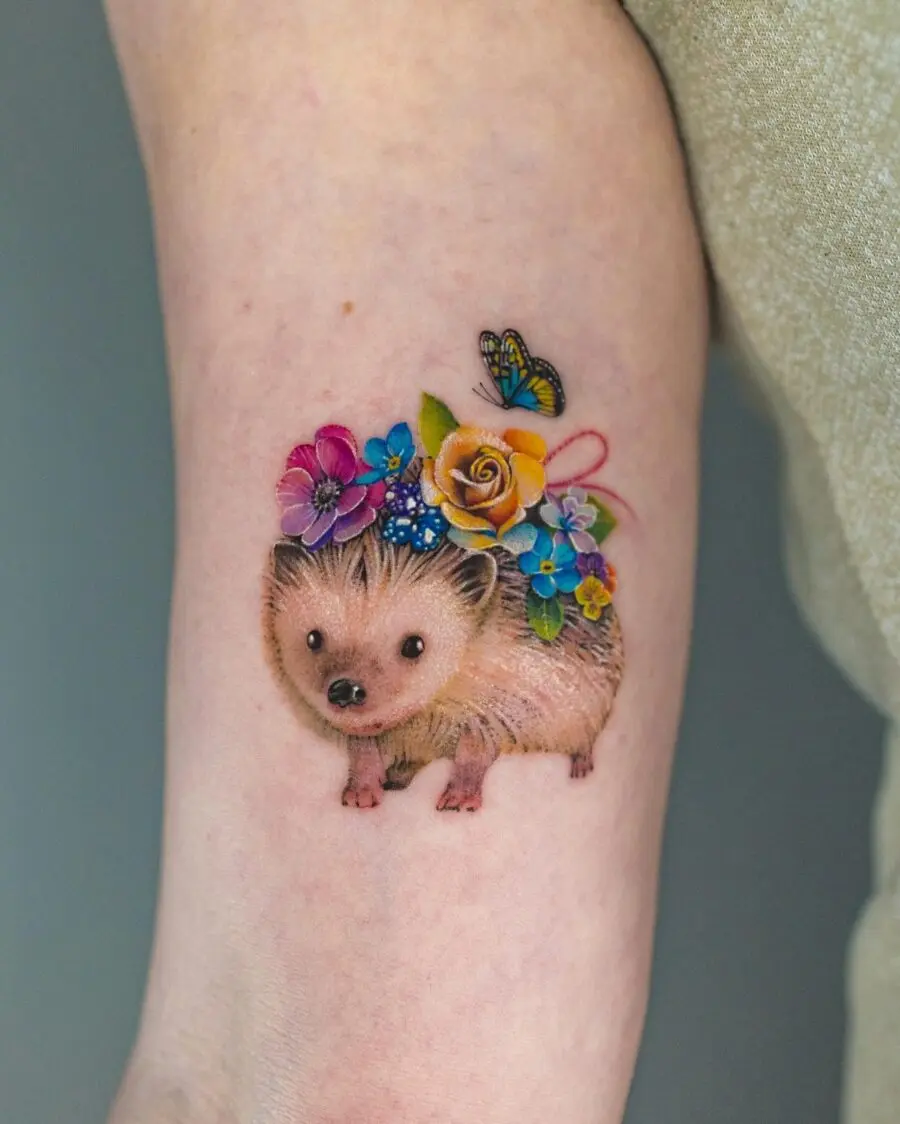 Cute hedgehog tattoo adorned with flowers