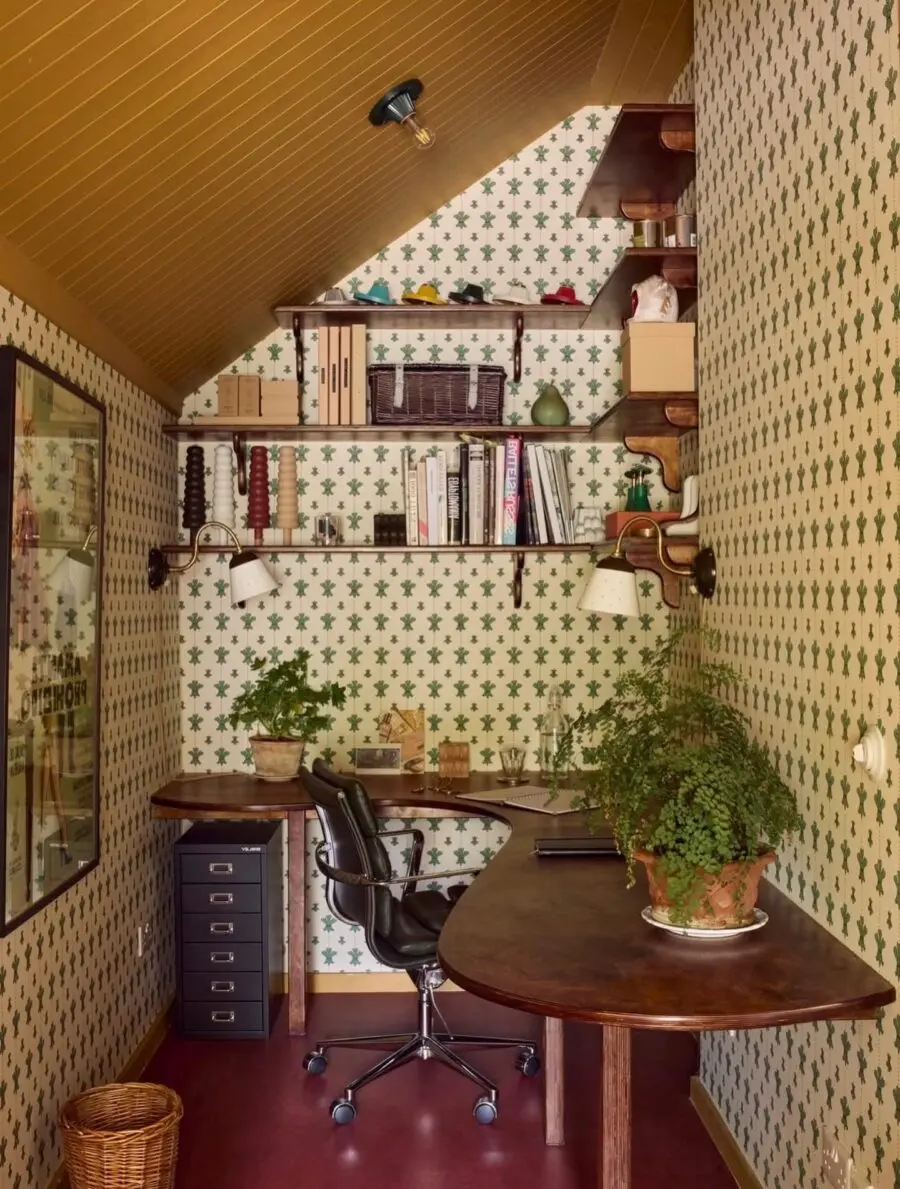 Charming corner workspace bursting with greenery