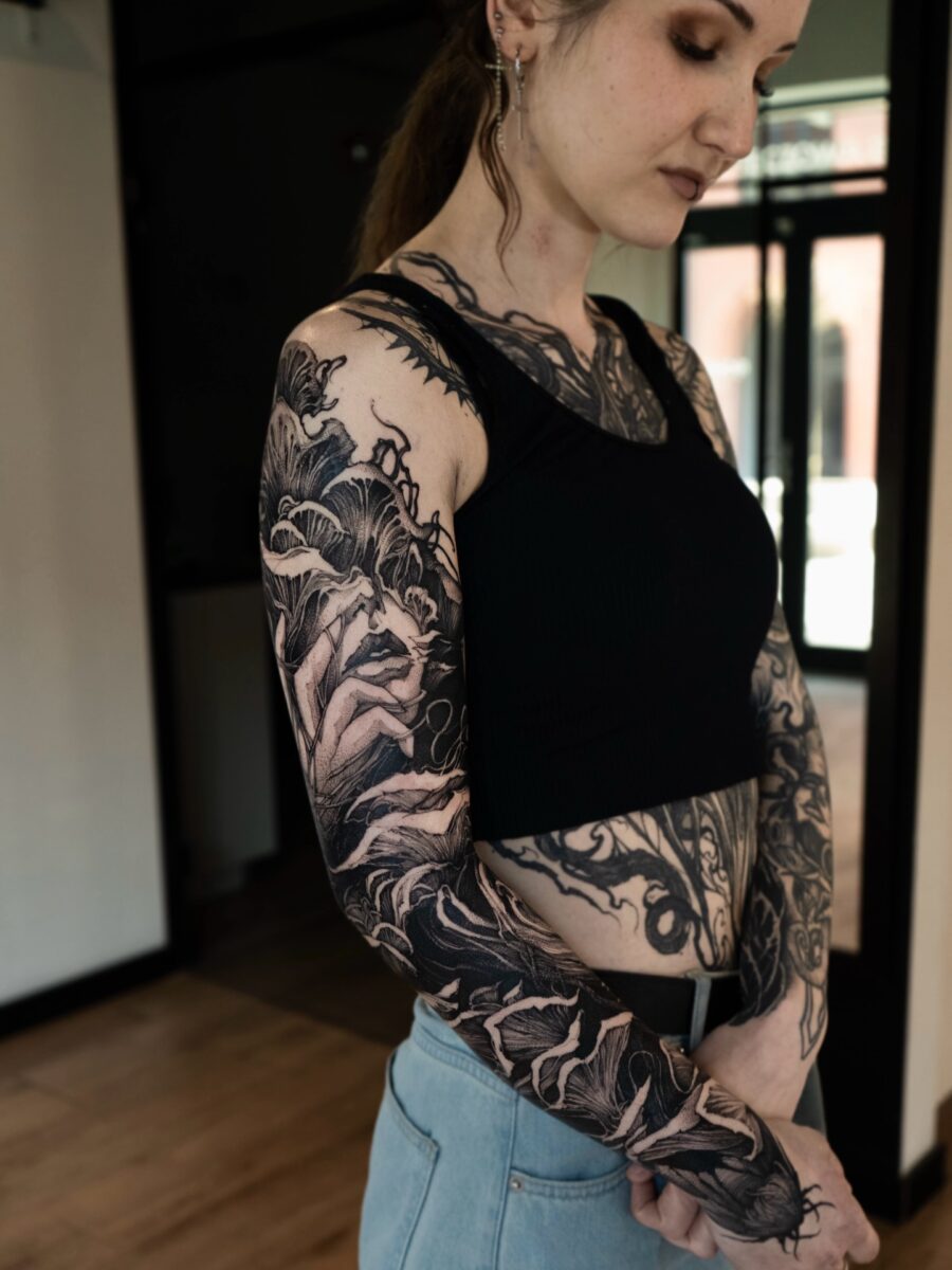 Stunning black sleeve tattoo showcasing intricate details