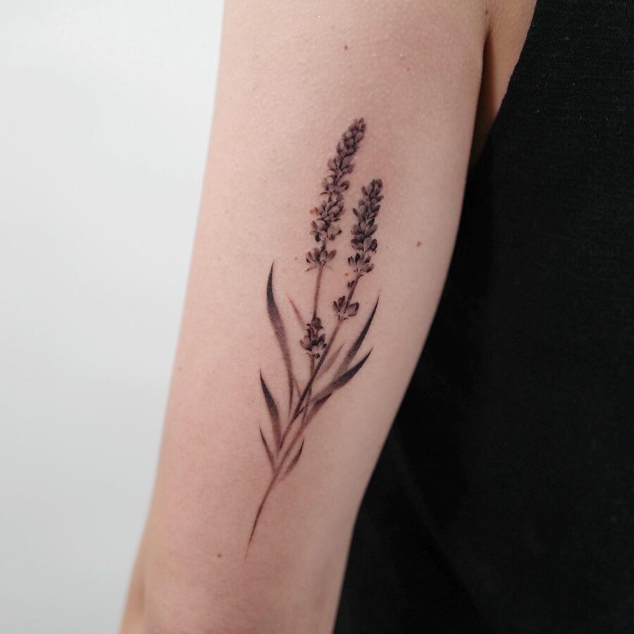 Elegant lavender tattoo on a delicate arm
