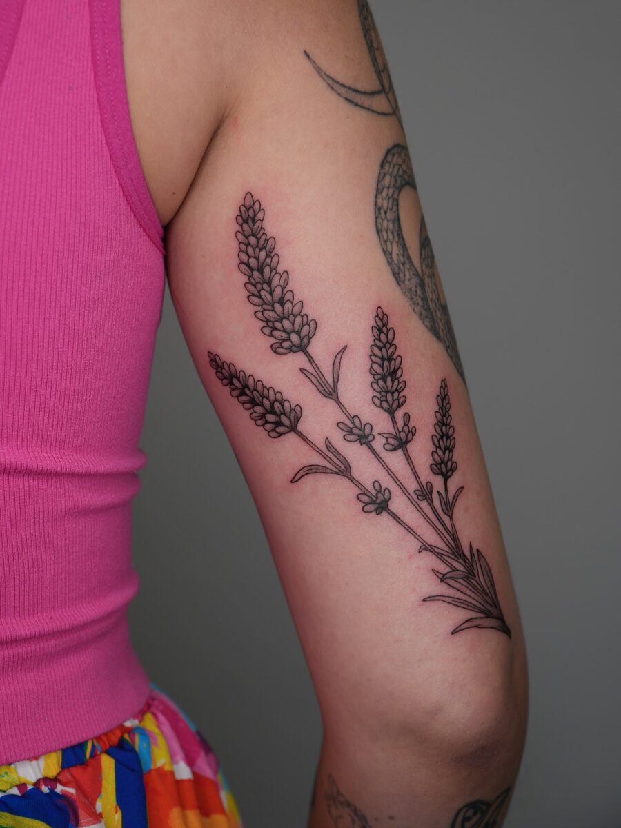 Elegant lavender tattoo with intricate details